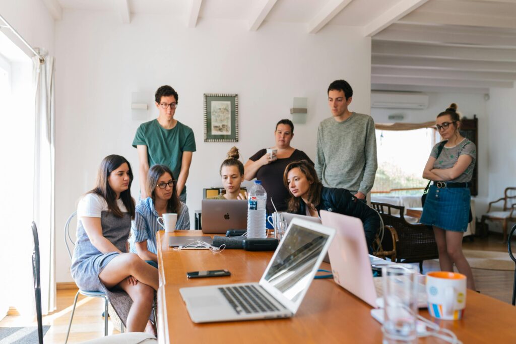 team building: a team working together to solve a problem in an office