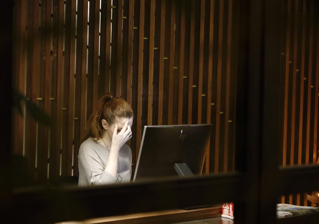 Burned out worker by her laptop